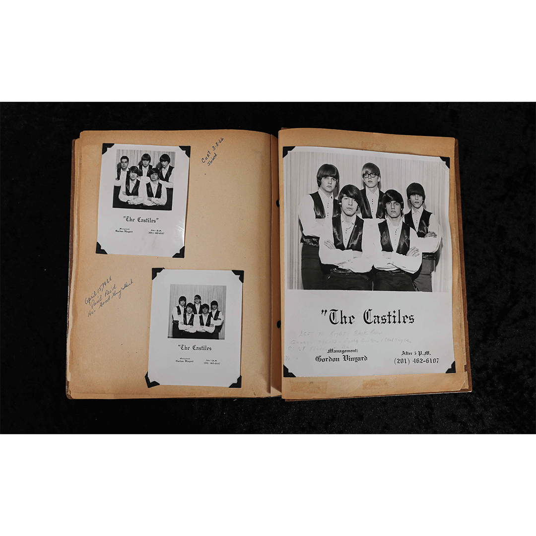 Open scrapbook with four black-and-white photos of "The Castiles," a band. Photos are mounted on worn pages with handwritten captions, evoking nostalgia.