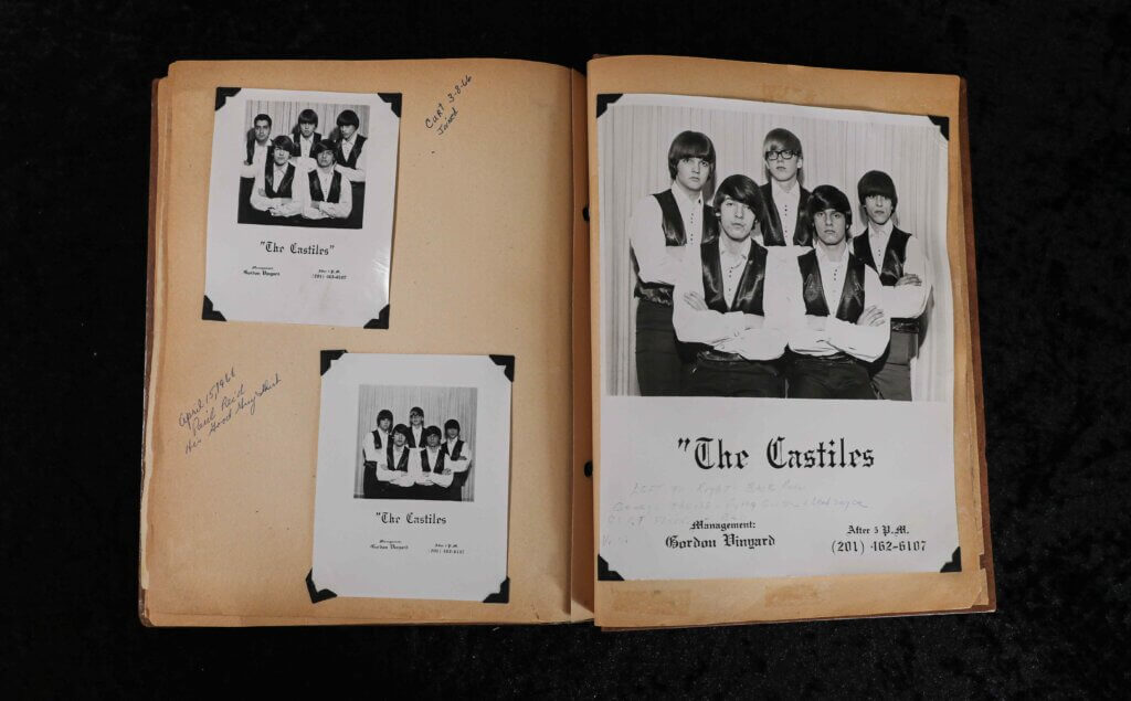 Open scrapbook displaying black-and-white photos of a band named "The Castiles." The images show five young men in vests, exuding a vintage 1960s vibe.