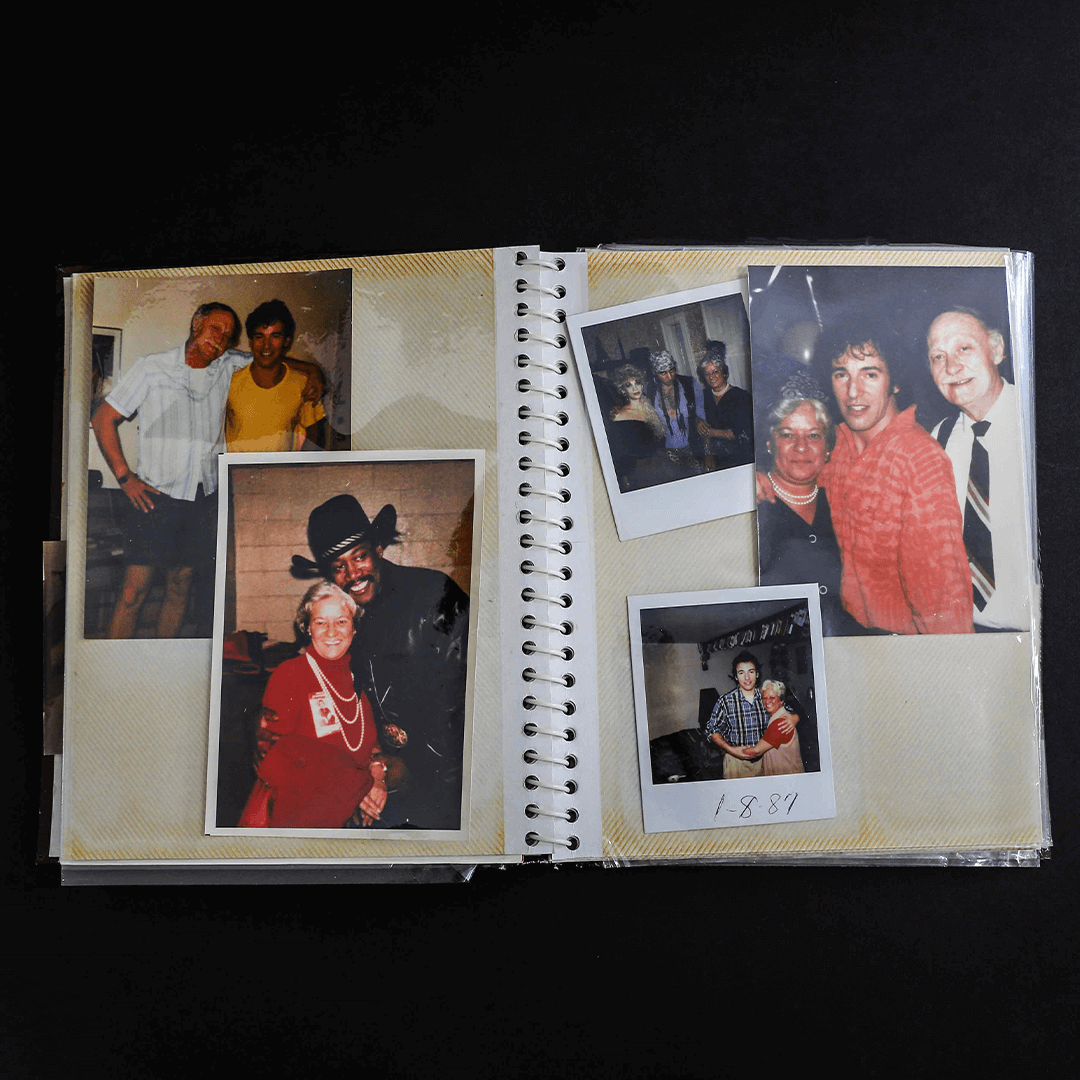 An open photo album displays vintage family photos. Smiling individuals pose in casual and formal attire, conveying warmth and nostalgia.