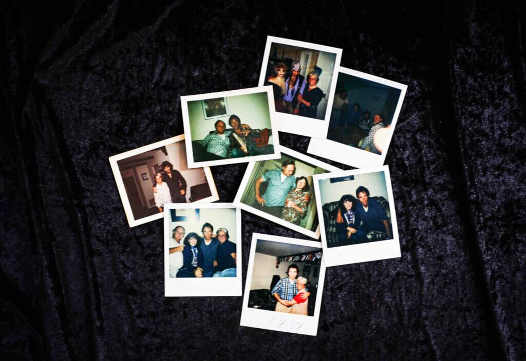 A collection of eight vintage Polaroid photos scattered on a dark, textured surface. Each photo captures joyful family moments and friendships.