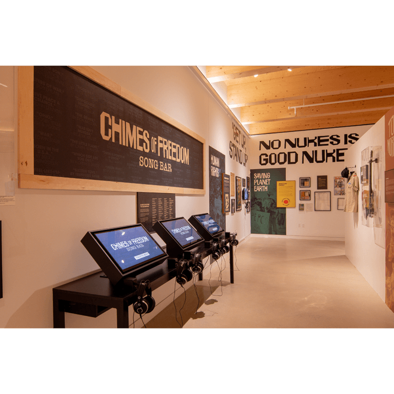 The Chimes of Freedom Song Bar, with interactive listening kiosks and protest-song posters