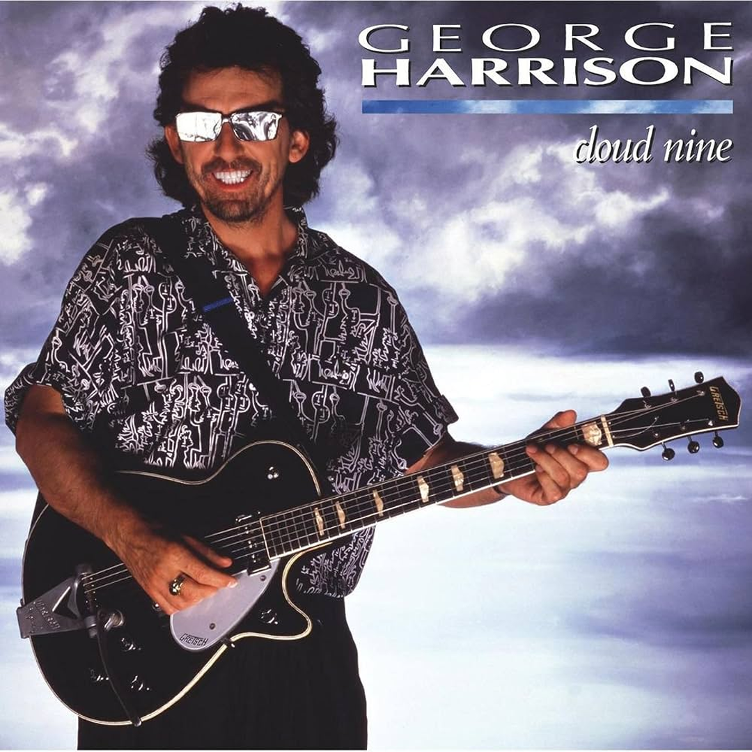 Album cover for George Harrison's Cloud Nine, featuring the artist wearing mirrored sunglasses and a patterned shirt while holding a Gretsch guitar against a cloudy sky background.