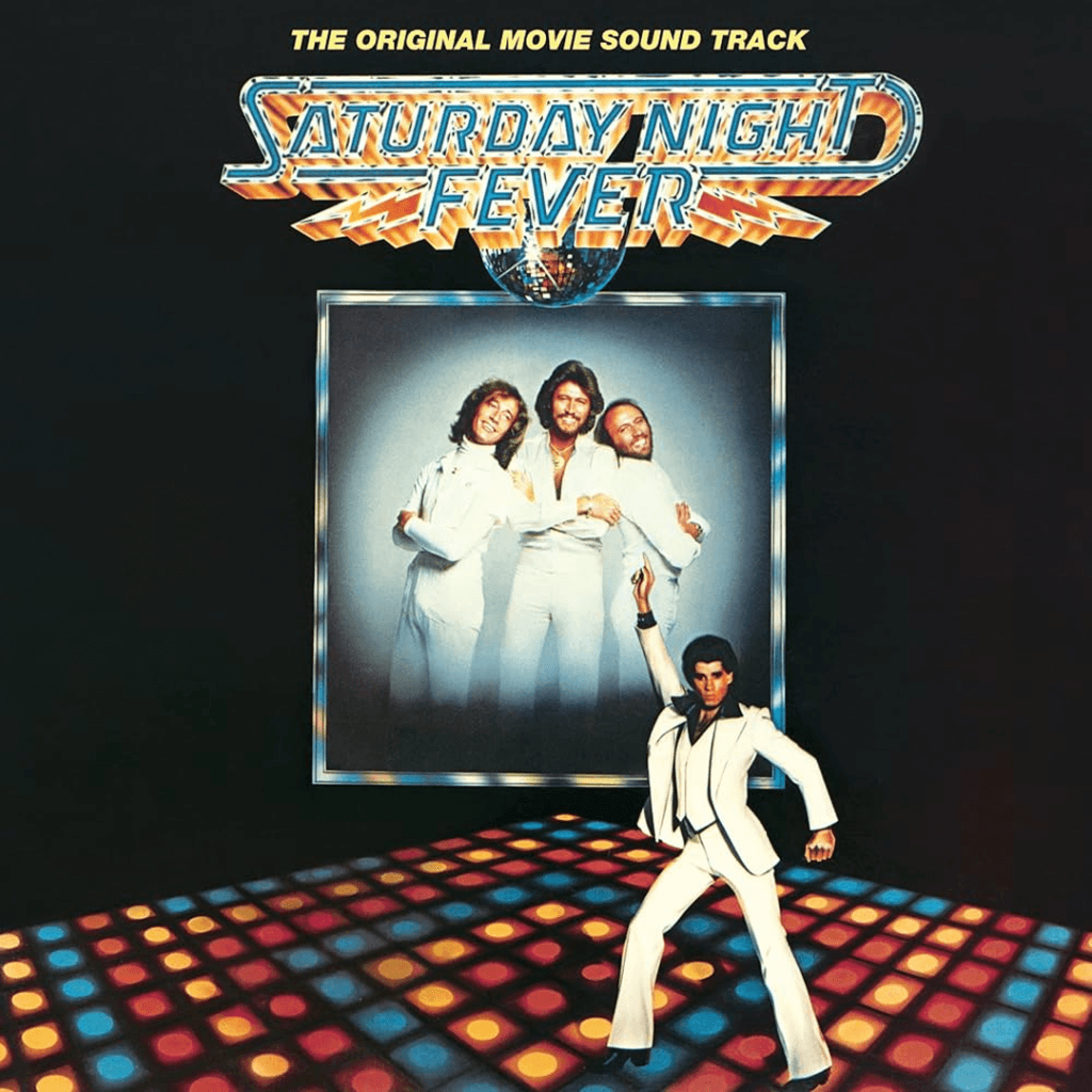 This image is the album cover for the soundtrack to the 1977 film Saturday Night Fever. It features John Travolta’s iconic pose on a lighted dance floor, with the Bee Gees pictured in the background.