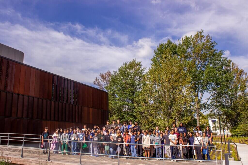 Biotechnology High School freshmen in a group photo outside the Bruce Springsteen Center for American Music
